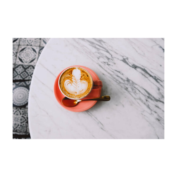 Trendy Pink Cup Of Hot Cappuccino On Marble Table Background. Beautiful Latte Art On The Top.